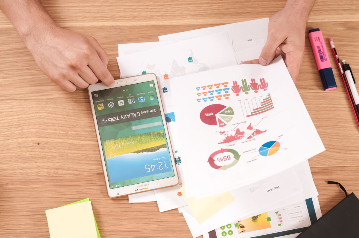 Business professionals reviewing financial statements across multiple views